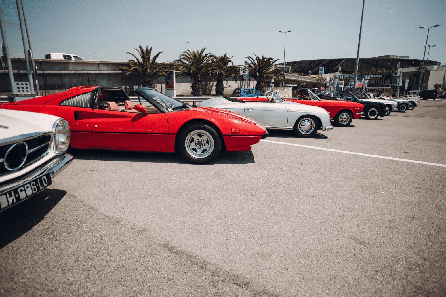 a group of cars parked in a parking lot